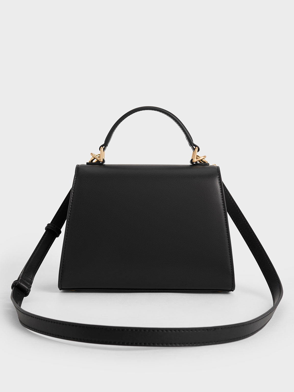 กระเป๋าถือหูจับด้านบนทรงสี่เหลี่ยมคางหมูรุ่น Violetta, สีดำ, hi-res