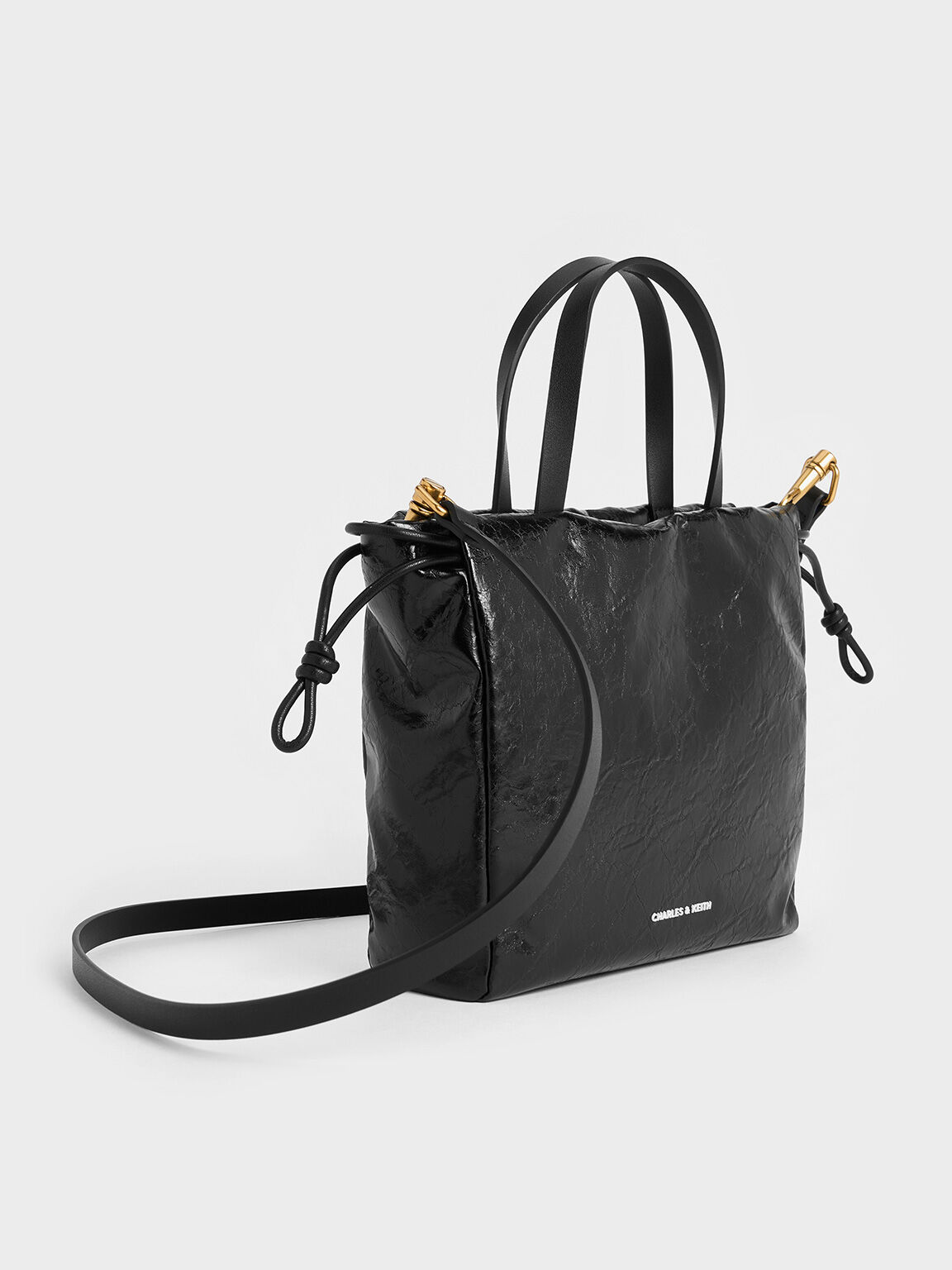 กระเป๋าโท้ทขนาดเล็กดีไซน์ลายย่นที่ปิดแบบเชือกรูดรุ่น Bethel, สีดำ, hi-res