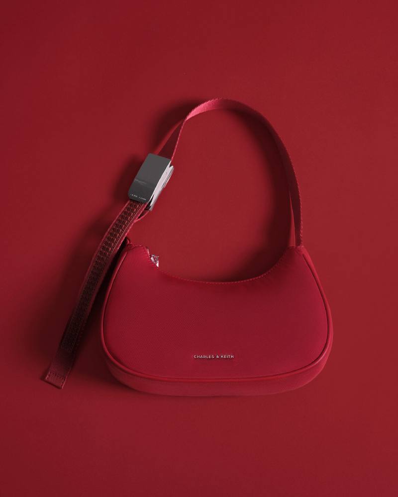 Women’s nylon curved metallic-accent shoulder bag in red - CHARLES & KEITH