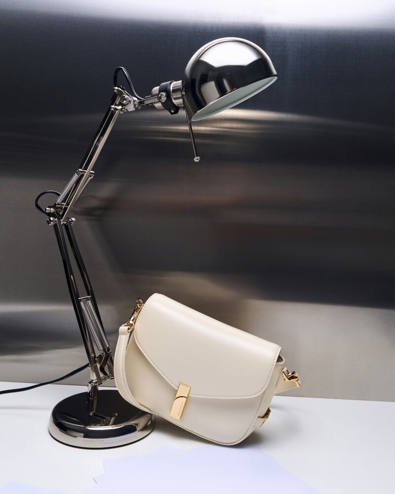 Women’s Aurelia metallic-accent saddle bag in cream - CHARLES & KEITH