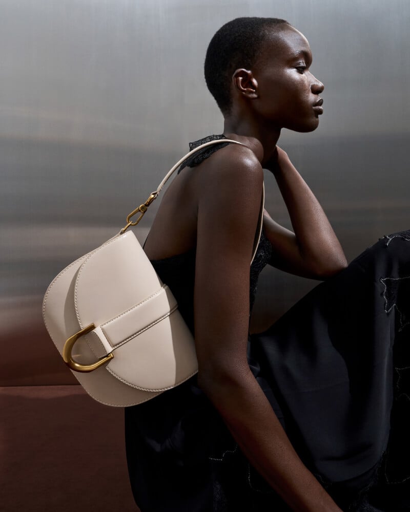 Women’s Gabine leather saddle bag in oat - CHARLES & KEITH